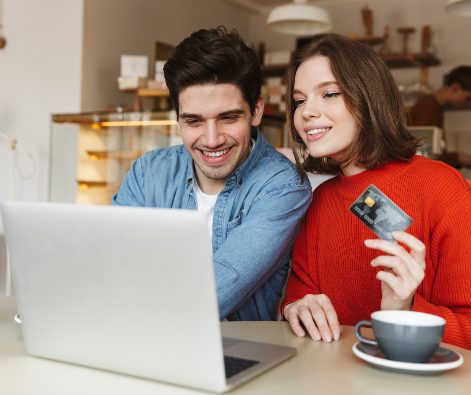 Couple reviewing credit card strategy on laptop to rebuild their credit score faster