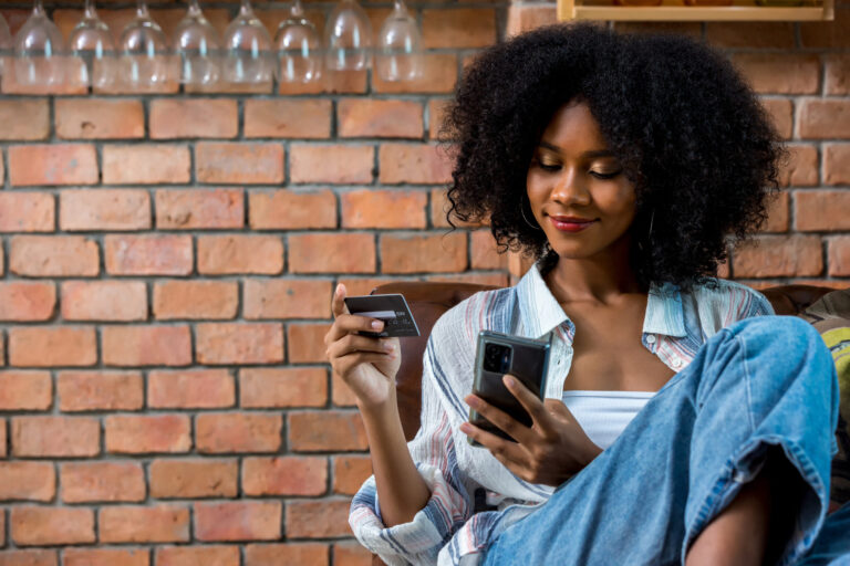 Young woman learning how to keep track of her budget