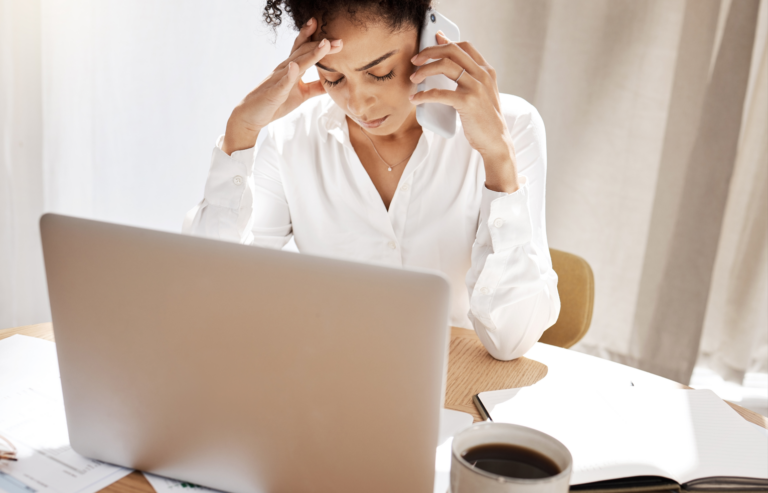 Phone call over credit card disputes, stress and black woman frustrated, laptop and reporting theft with bills at desk