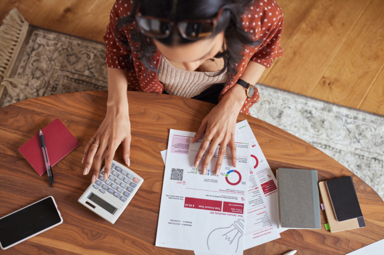 Woman calculating financial bill what is a good debt-to-income ratio at home